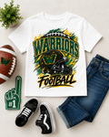 A white kids' short-sleeve T-shirt with a green, yellow, and black 'Warriors Football' graphic, styled in a flat lay with blue jeans, black sneakers, a football, a foam finger, and a small plant on a light beige background.