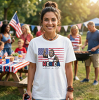 Woman wearing a t-shirt with a graphic design at a outdoor gathering.