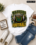 A white graphic t-shirt featuring a distressed green and yellow 'WARRIORS FOOTBALL' design with a football and 'W' logo, styled in a flat lay with blue jeans, white sneakers, a small sign, and a football on a beige background.